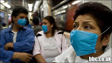 Mujeres en Méjico con mascarillas para evitar la infección